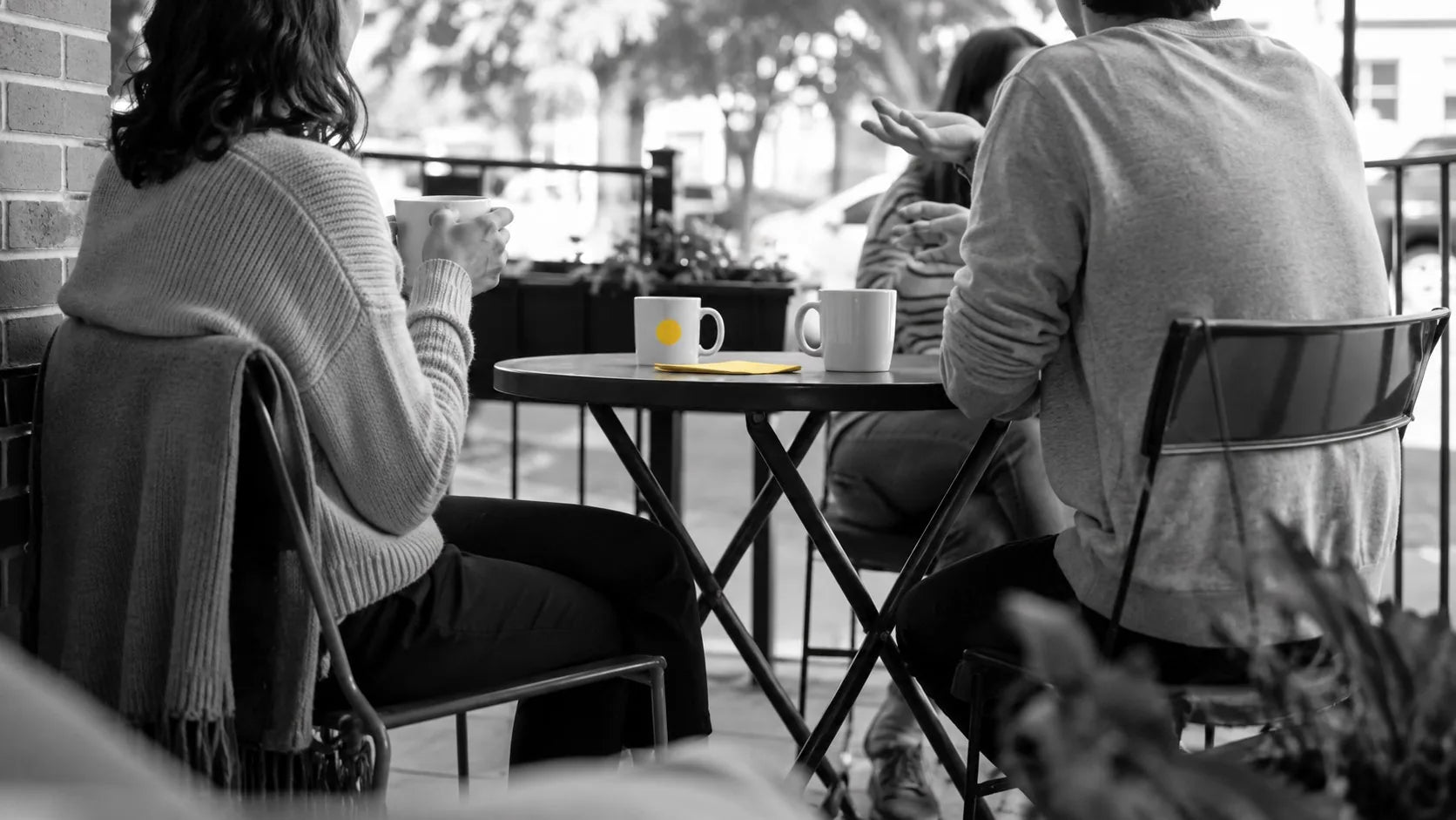 Friends talking at a cafe